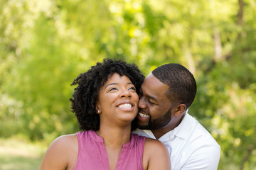 Happy African American couple laughing and smiling.