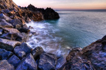 Jagged rocks form a formidable coastal bay