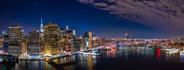 Wall Mural - Aerial panorama of the Lower Manhattan and Brooklyn Bridge by night