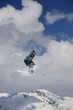 © Vasily Merkushev - Flying skier on snowy mountains. Extreme winter sport, alpine ski. Copy space.
