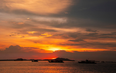 Wall Mural - Sunset at the sea withcloud scape background