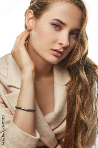 A Portrait Of A Caucasian Lady With Curly Hair Wearing A Woolen