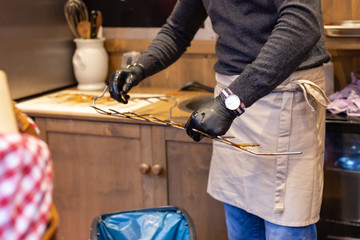 cleaning fish grill on christmas stall