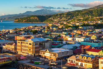 Fototapete - Roseau, city and cruise port of Dominica. Beautiful cityscape view at sunset.