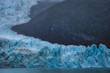 Deep blue ice of melting glacier on waterfront