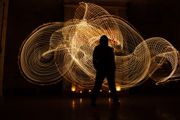 human silhouette against backlight. light painting photography.