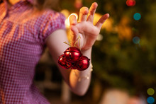 Three Little Red Jingle Bells In The Hand Of Child
