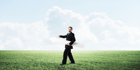 Conceptual image of businessman pointing aside