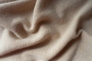 Wall Mural - Soft folds of simple beige knitted fabric