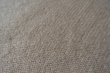 Wall Mural - Closeup of beige knitted fabric (reverse stockinette stitch)