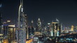 Scenic Dubai downtown skyline timelapse at night. Rooftop view of Sheikh Zayed road with numerous illuminated towers.