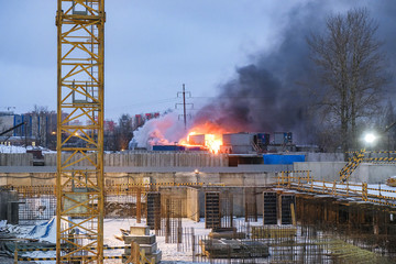 a fire in a residential town on the construction site