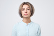© Viktor Koldunov - Passport photo. Portrait of european young woman in blue shirt