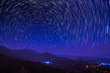 © Yuttana Joe - Beautiful Star Trails above high mountain at night, Tham Sakoen View Point attraction on route 1148 Phayao-Nan, Tham Sakown National Park, Nan Province, northern of Thailand.