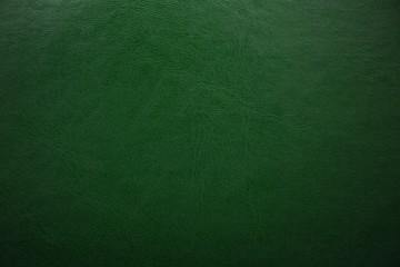 Green textured leather background. Abstract leather texture.