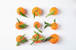 Flat lay composition with ripe tangerines on white background