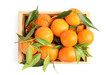 Wooden crate with tasty ripe tangerines on white background, top view