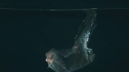 Wall Mural - plastic bag in water, pollution environmental problem concept