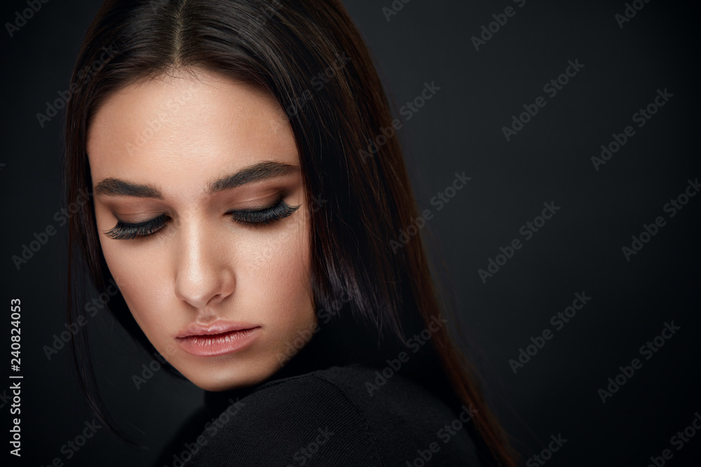 Obraz na płótnie Eyelashes Makeup. Woman Beauty Face With Black Lashes Extensions w salonie