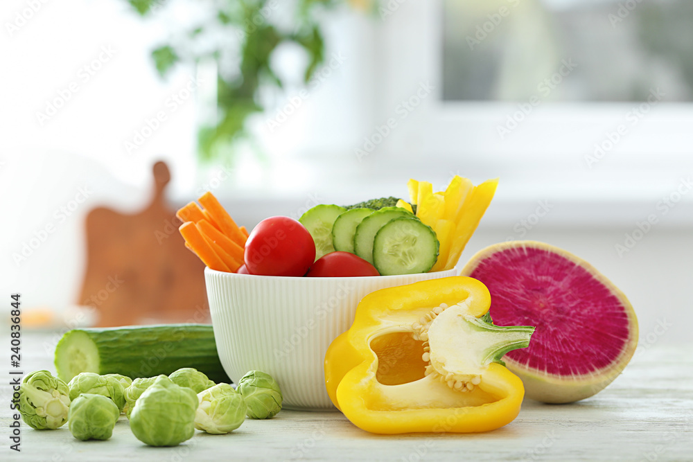 Bowl with fresh vegetables on table. Diet food