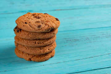 Poster - stack of sweet cookies on blue background