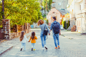 Parents traveling with their daughters around the country