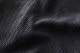 Fototapeta  - Close-up polyester fabric texture of black athletic shirt