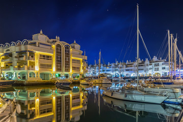 Benalmadena mediterranean port village. Yacht harbor, marina pier and boat, dock yachts and vessels in Benalmadena, Malaga