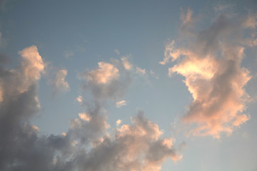 Wall Mural - Sky clouds as the best picture. The most abstract background image of the sky. Beautiful sunset. The sun  rays illuminate the clouds.