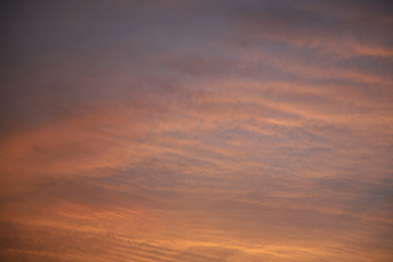 Wall Mural - Sky clouds as the best picture. The most abstract background image of the sky. Beautiful sunset. The sun  rays illuminate the clouds.