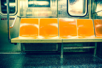 Wall Mural - View inside New York City subway train car with vintage orange color seats