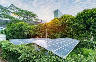 ecological energy renewable solar panel plant with urban landscape landmarks