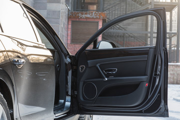 open door of the car black leather car interior