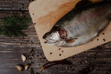 Fototapeta Tęcza - red fish wooden cutting Board . rainbow trout