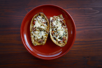 Wall Mural - Meat stuffed eggplants recipe on wood