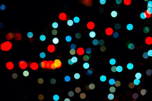 Red And Light Blue Bokeh On Black Background