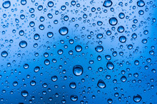 Water Drops On Glass Window Blue Background After The Rain In The Autumn Fall