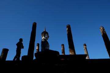 Wall Mural - Sukhothai historical park the old town of Thailand Ancient Buddha Statue at Wat Mahathat in Sukhothai Historical Park,Thailand