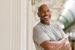 © digitalskillet1 - Happy mature African American man smiling outside.