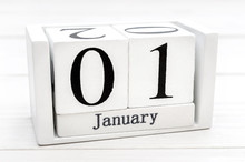 Date Of 1st January On Wooden Cubes On Wooden Background. Top View. Space For Text.