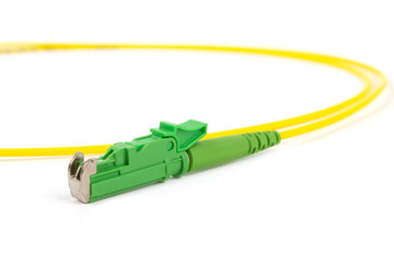 single mode patch cord jumper with green fiber optic connector isolated on white background