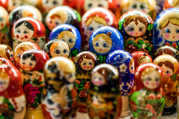 Wall Mural - Nesting wooden dolls. Colorful Russian matryoshka at the souvenirs market