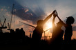 © khwanchai - Engineer teamwork, silhouette of construction worker team touching hand together for power at working site