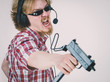 © Voyagerix - Gamer man shooting from gun