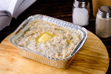 Poster - Morning Breakfast, Oatmeal porridge with butter, milk on a wooden table