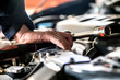 © Suppasit - Engine repair technicians are hold the wrench in order to repair the car..