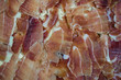 jamon slices tightly laid on a board