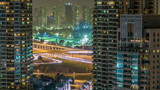 Fototapeta Miasto - Golf field timelapse from top at night time with traffic on sheikh zayed road.