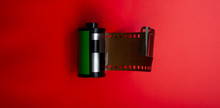 Cassette With The Film Lies On A Red Background.