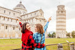 Happy friends in Pisa, Travel in Italy, group tourists and friendship concept